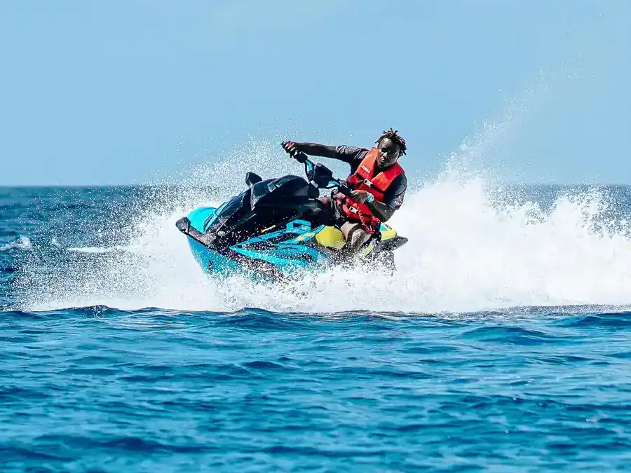 Guest enjoying an exciting jet ski ride in the crystal clear waters at Danglai Resort, Semporna