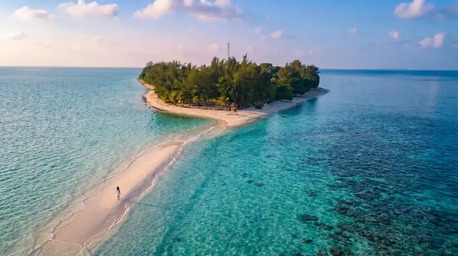 A professional dive buddy assisting scuba divers with Danglai Resort in the Celebes Sea