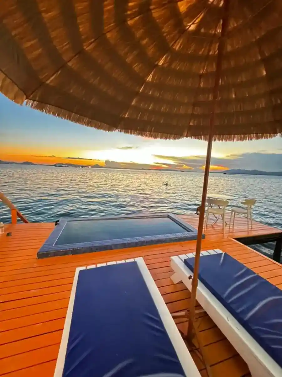 Take in the stunning sunset views from the private overwater balcony, complete with a plunge pool and sun loungers, at Danglai Resort, Semporna.